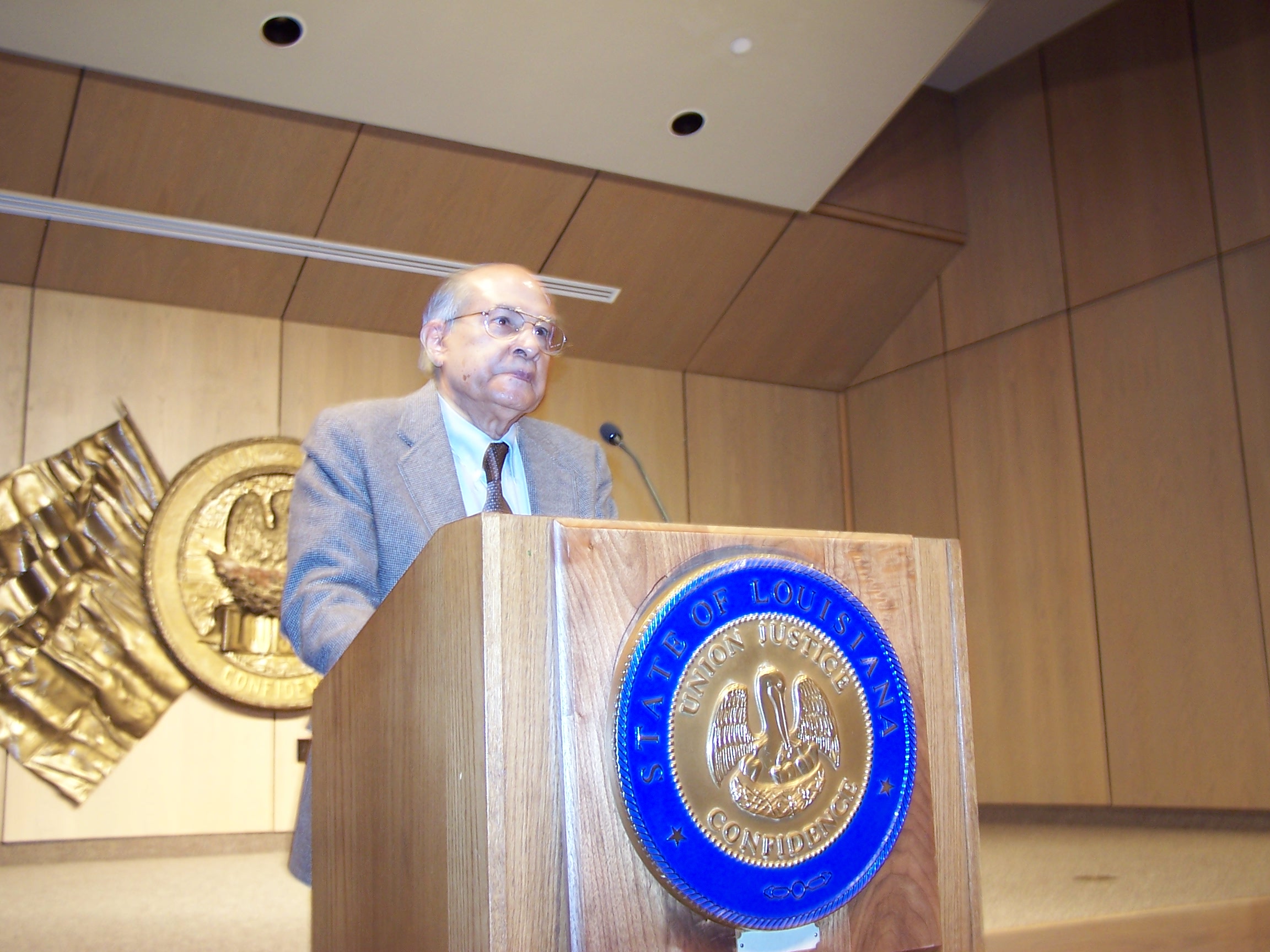 Dr. Din speaking at the March 2008 society meeting.